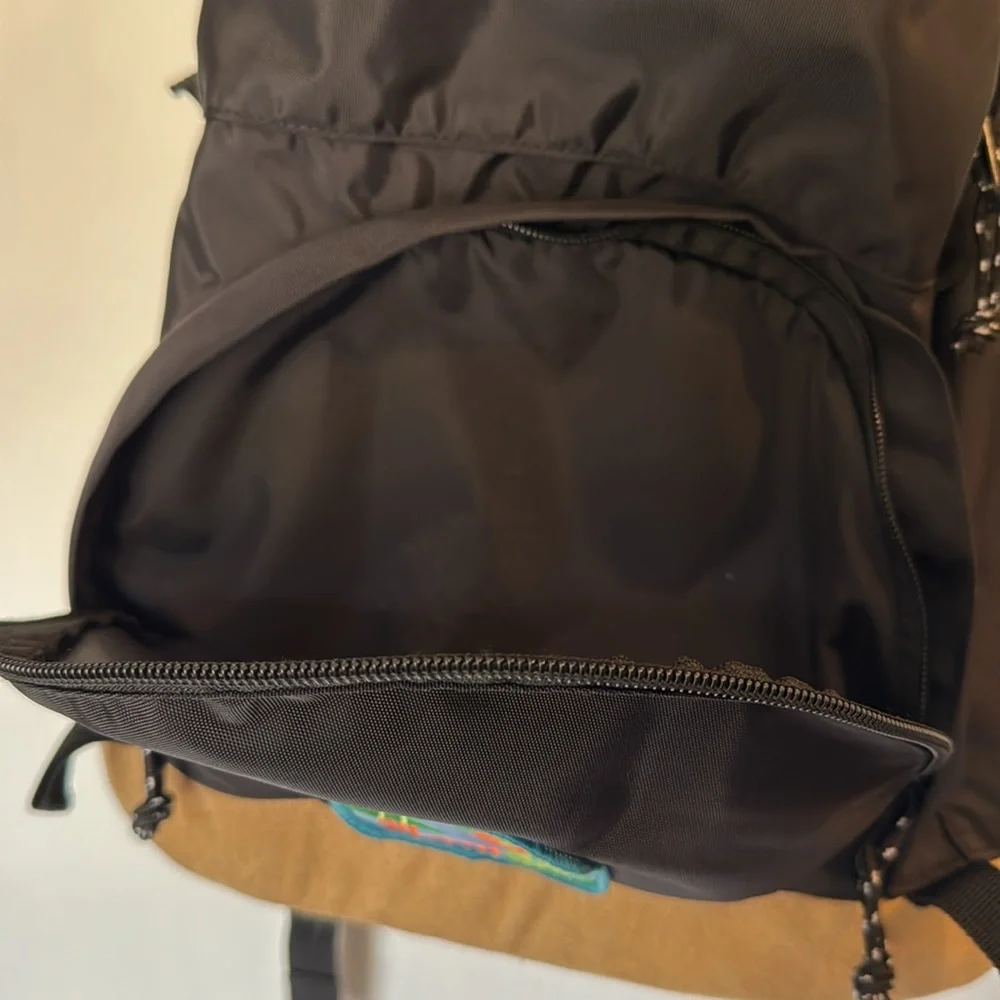 Urban Outfitters backpack Black and Tan Backpack with Patch contrast‎ base